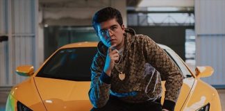 Fofo Márquez poses with a luxury sportscar.