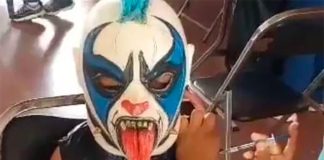 Dressed as Psycho Clown Miguelito gets his COVID shot.