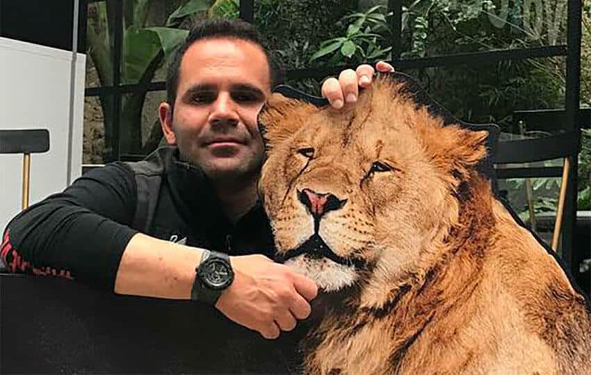 Sanctuary founder Eduardo Serio and a big cat. 