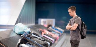 waiting at a baggage carousel in an airport