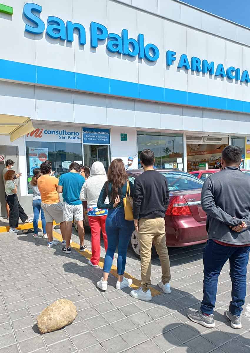 people waiting for COVID testing outside Queretaro pharmacy