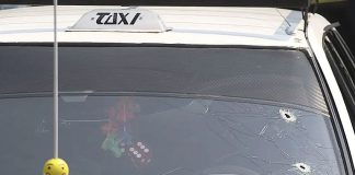 public transit van in Guerrero with bullet holes in windshield