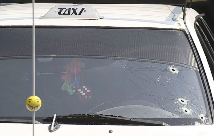 public transit van in Guerrero with bullet holes in windshield