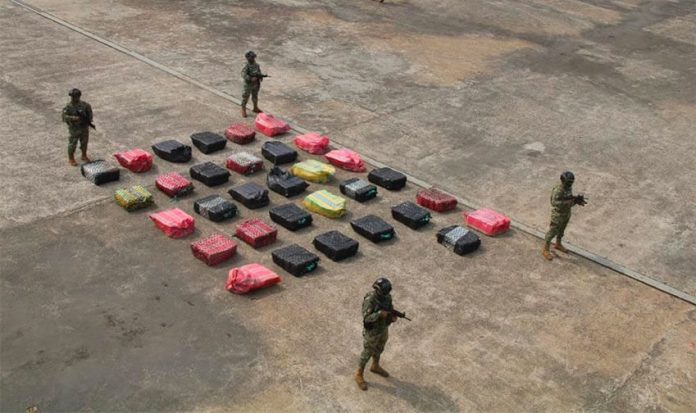 Marines stand guard over Wednesday's cocaine seizure.