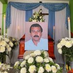 Flowers and a photograph of Guerrero journalist Fredid Román, at his wake in Acapulco.