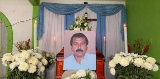 Flowers and a photograph of Guerrero journalist Fredid Román, at his wake in Acapulco.