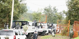 National Guard trucks transport alleged members of Pueblos Unidos after their arrest in Michoacán.