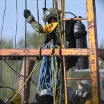 An army diver descends into the mine.