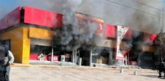 An Oxxo store burns