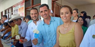 Participants hold their share of the cheese made for the 2019 Biggest Queso Fresco of Mexico Festival.