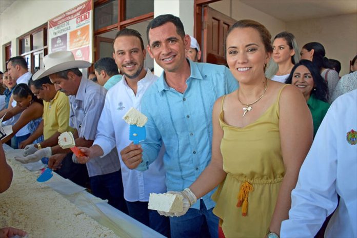 Participants hold their share of the cheese made for the 2019 Biggest Queso Fresco of Mexico Festival.