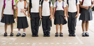 Students in school uniform pants and skirts.