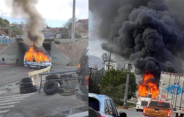A burning car and trailer block the road in two side-by-side photos