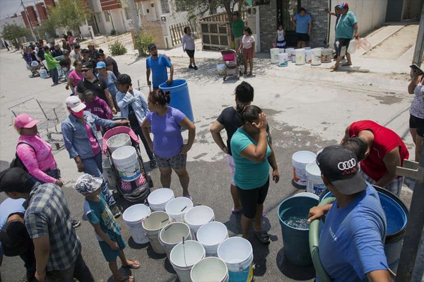 Residents line up at a water truck in Monterrey. In some parts of the city, water service has been unreliable for months due to the drought.