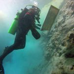 Artist Victor Cruz painting underwater at Pozo el Gavilan, Mexico