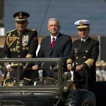 President López Obrador celebrates the start of the Mexican Revolution in a 2021 military parade, accompanied by Army Minister Luis Cresencio Sandoval and Navy Minister José Rafael Ojeda Durán.
