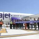 Dominican ambassador María Isabel Castillo Báez and other officials celebrate Arajet's new route at AIFA.