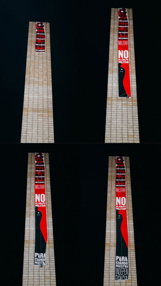 The climbers worked throughout the night to scale the more than 100-meter tower and unfurl the banner, as seen in this series of photos.