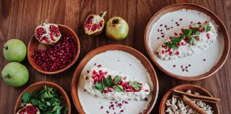Chiles en nogada, surrounded by its ingredients.