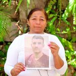 Rosario Lilián Rodríguez holds a picture of her son.