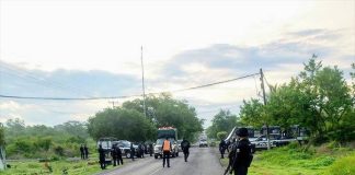 Vehicles pass through a legally-established police checkpoint along the Apatzingán-Aguililla highway in Michoacán last year.