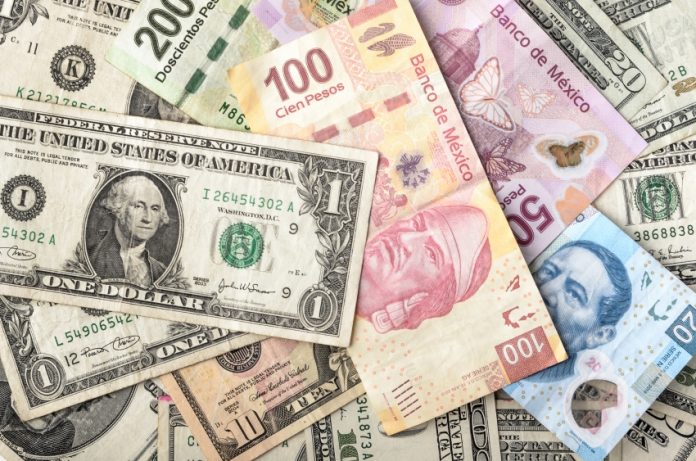 Pesos and dollar bills mixed together.
