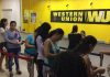 Clients wait in line at Western Union, a popular money transfer service.