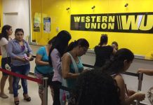 Clients wait in line at Western Union, a popular money transfer service.