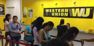 Clients wait in line at Western Union, a popular money transfer service.