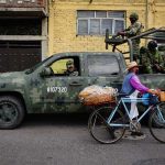 Military patrol on city street