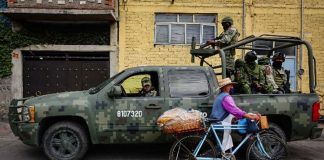 Military patrol on city street