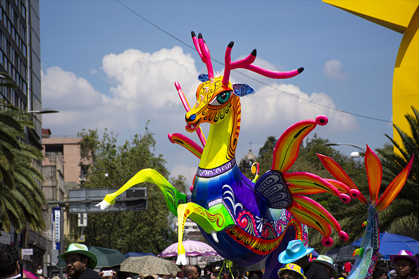 A brightly colored alebrije on parade in Mexico City.