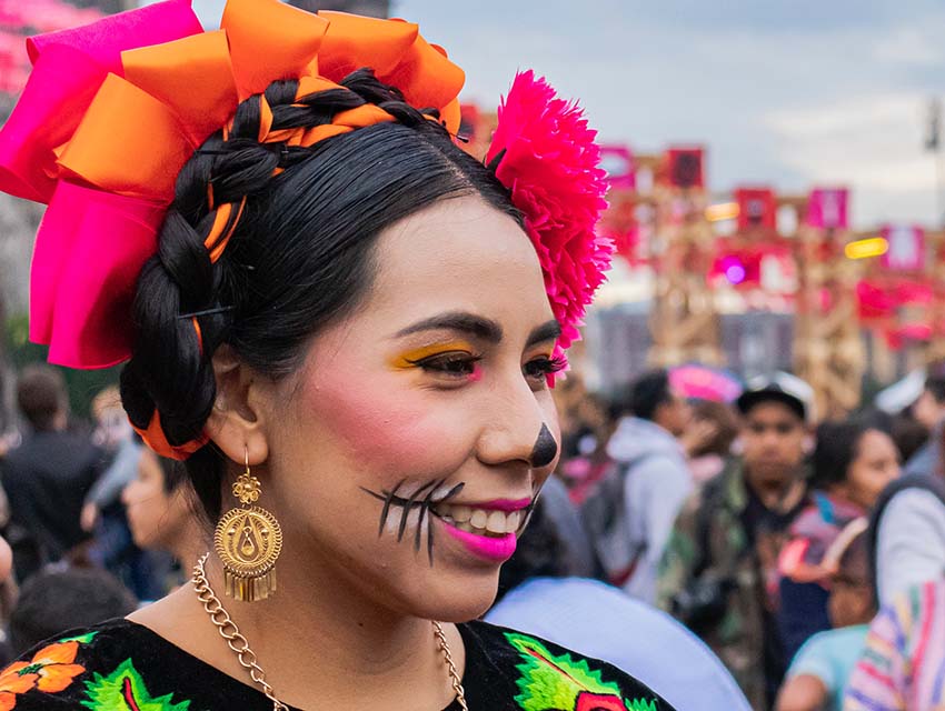 Woman dressed up for festivities in Mexico City’s zócalo.