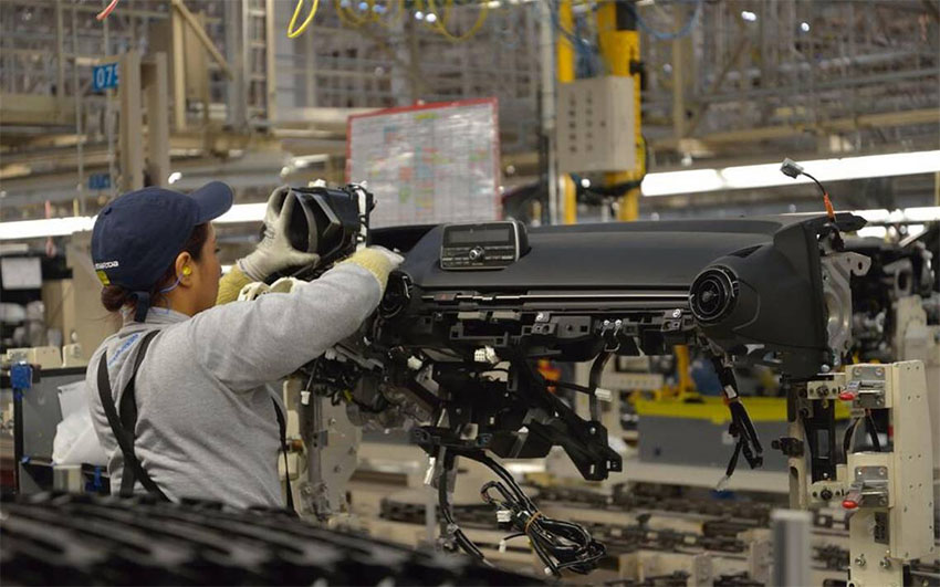 A woman at work in a vehicle manufacturing plant in Guanajuato.