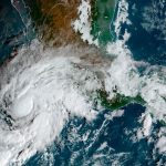 Tropical Storm Roslyn approaches the Pacific coast in this satellite photo, taken at 10 a.m. Friday morning.