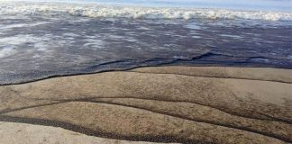 Local residents reported beaches streaked with oil and a foul smell along the coast.