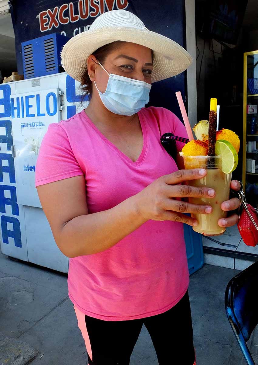 Mexican drinking tejuino (corn beer)