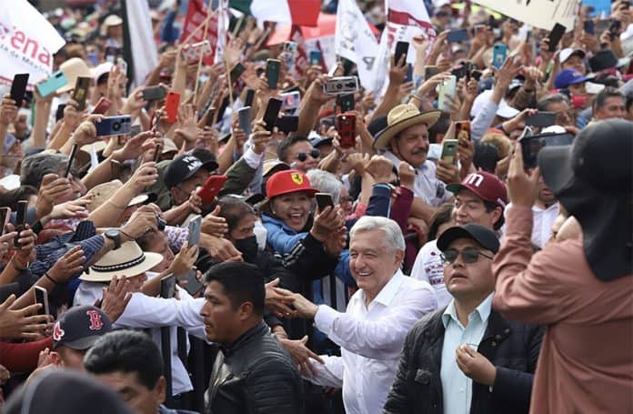 Dense crowds of supporters greet President López Obrador as he arrives at the Zócalo in Mexico City.