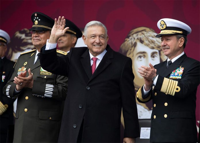 President López Obrador with military leaders at Sunday's Revolution Day ceremony.