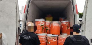 Federal authorities in Jalisco prepare to destroy 13 tonnes of chemical precursors seized from secret laboratories, in August 2021.