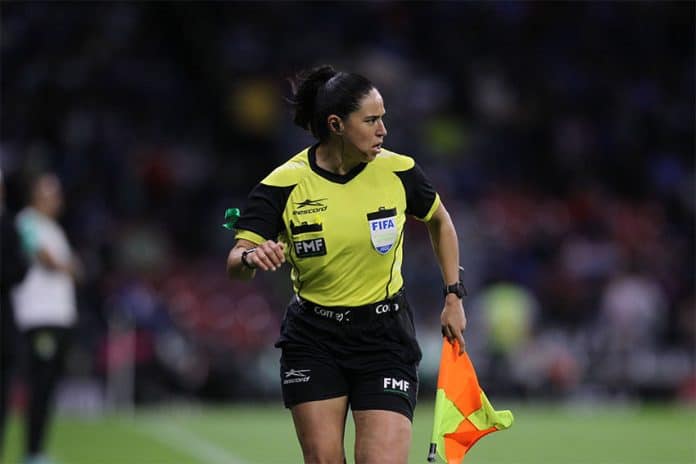 Karen Díaz runs alongside the action at a Cruz Azul versus León game in October, where she acted as assistant referee.