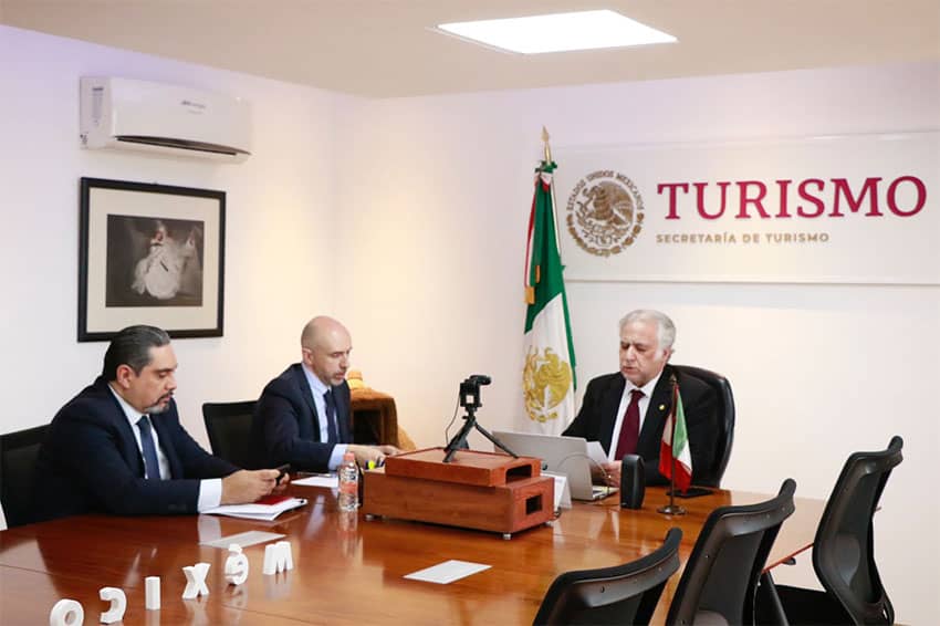 Tourism Minister Miguel Torruco (right) and other officials tune into a virtual meeting with the U.S. State Department.