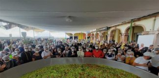 Participants and spectators crowd around the record-breaking batch of guacamole on Sunday.