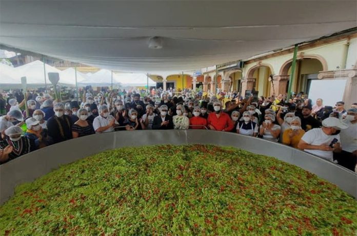 Participants and spectators crowd around the record-breaking batch of guacamole on Sunday.
