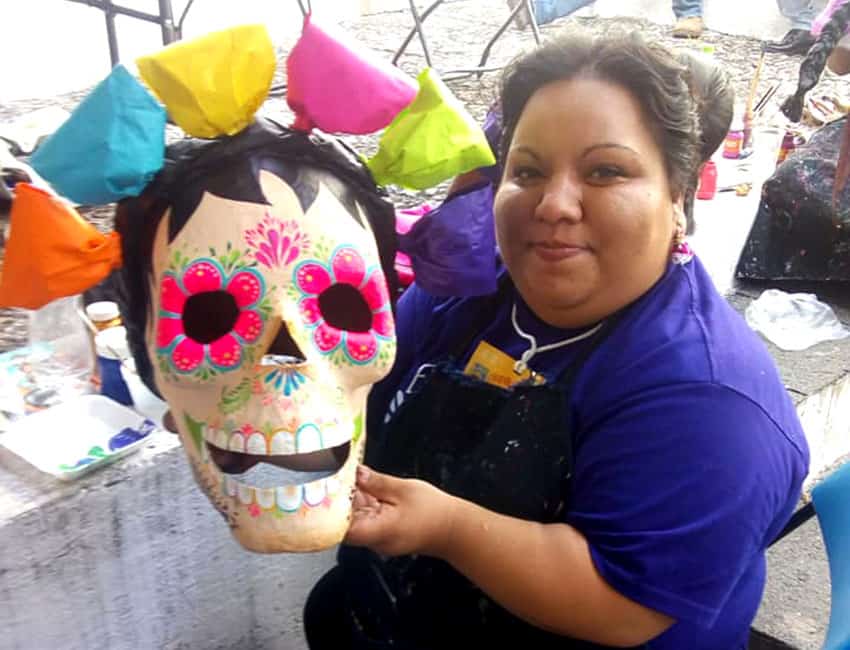 Papier mache artisan Rosita Lemus of Mexico with one of her creations