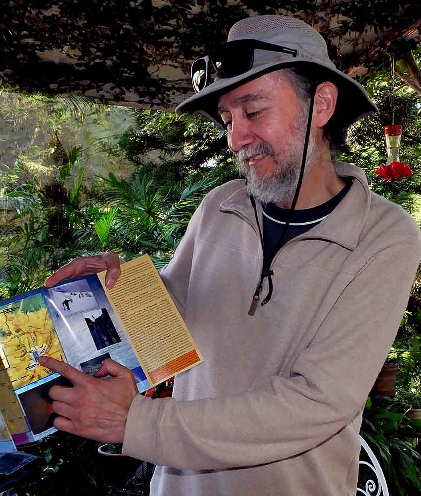 Explorer Jorge Neyra with his foldout guide to Popocatepetl