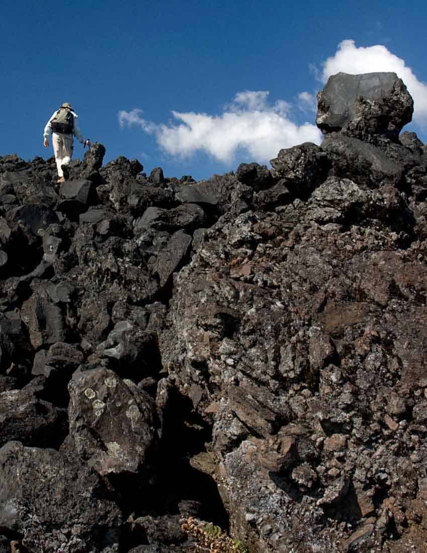 A geologist crossing the lava field at Paricutín Volcano, Michoacán.