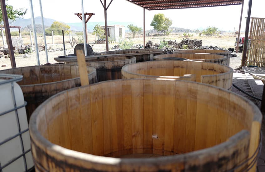 Agave hearts vats at OAX Original mezcal distillery in Oaxaca.