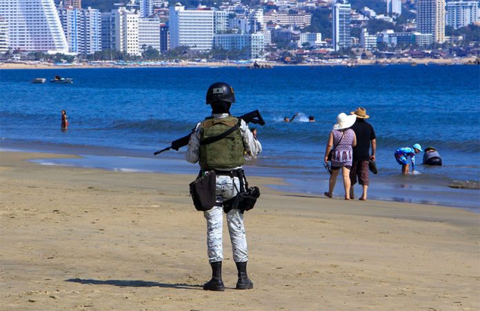 A member of the National Guard patrols a beach in Acapulco, Guerrero, last week.
