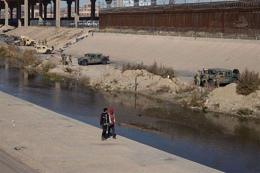 Members of the Texas National Guard parked tanks and set up barbed wire barricades to prevent migrants from crossing the Rio Grande, on Wednesday.